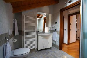 a bathroom with a toilet and a sink at [Entire Villa] Lakes & Borromean Islands in Sesto Calende