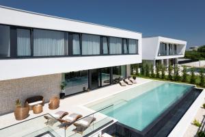 an image of a house with a swimming pool at Villa Aurum ZadarVillas in Zadar