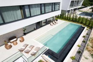 an aerial view of a house with a swimming pool at Villa Aurum ZadarVillas in Zadar +37 photos