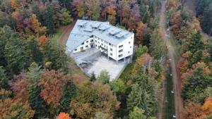 an aerial view of a building in the forest at Forest View, 2-floor Apartment in Pohorje