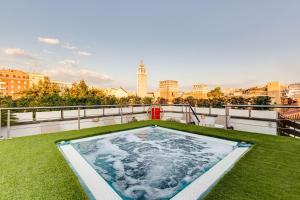 a hot tub on the roof of a building at Best Western Cinemusic Hotel in Rome
