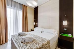 Postel nebo postele na pokoji v ubytování Best Western Cinemusic Hotel