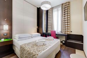 Postel nebo postele na pokoji v ubytování Best Western Cinemusic Hotel