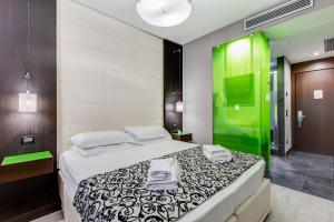 Postel nebo postele na pokoji v ubytování Best Western Cinemusic Hotel