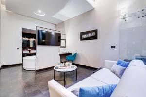 TV a/nebo společenská místnost v ubytování Best Western Cinemusic Hotel