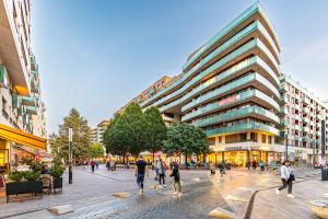 a group of people walking in a city street at Benett apartman in Budapest