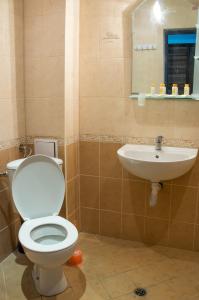 a bathroom with a toilet and a sink at Ivtour Apartments in Yalta complex in Golden Sands