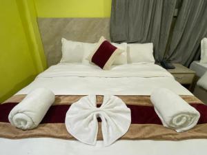 Voodi või voodid majutusasutuse Hotel Kavya Inn toas
