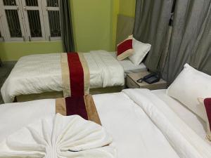 Voodi või voodid majutusasutuse Hotel Kavya Inn toas