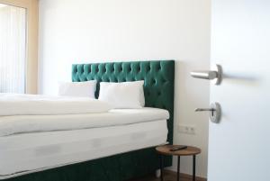 Rúm í herbergi á Aparthouse Leonhard