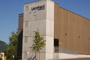 a building with a sign on the side of it at Aparthouse Leonhard in Feldkirch