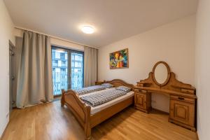 Posteľ alebo postele v izbe v ubytovaní Garden Towers Apartments