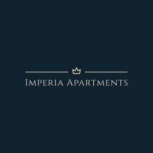 un logotipo para los departamentos anarquistas con una corona en él en Imperia Apartments, en Vrnjačka Banja