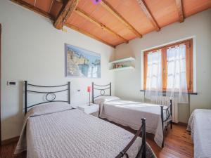 Postel nebo postele na pokoji v ubytování Holiday Home L'Aia by Interhome