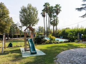 a playground with a slide in a park at Villa Villa Valentina by Interhome in Pisciarelli