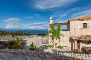 a stone house with a view at Villa Armos in Skinária