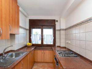 A kitchen or kitchenette at Apartment Gregal by Interhome