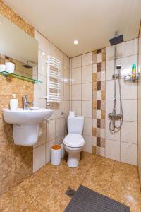 a bathroom with a toilet and a sink at Blacksmith's House - Old Town in Plovdiv