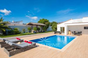 a villa with a swimming pool and a house at Private Villa in Golf del Sur in San Miguel de Abona