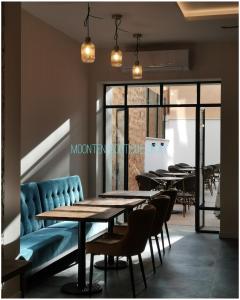 a row of tables and chairs in a restaurant at MOONTEN Boutique Stay in Sóller