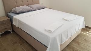 Postel nebo postele na pokoji v ubytování Hisar Prestige A