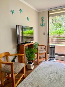 a living room with stars on the wall at Hermoso depto Pucon x Camino al Volcan in Pucón