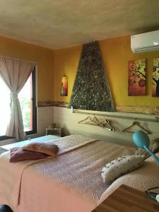 a bedroom with a bed and a window at El viento en los sauces in Sauce de Portezuelo