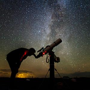 a man looking at the stars through a telescope at Spartia sea view Villa by "elite" in Volimes +38 photos