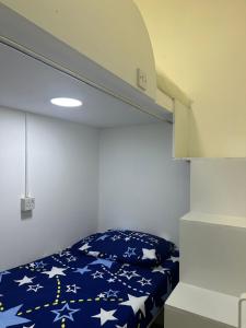 a bedroom with a bunk bed with stars on it at Deluxe Loft Rooms near Burjuman Metro Station , Bur Dubai in Dubai