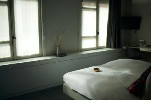 Postel nebo postele na pokoji v ubytování Hotel Matelote