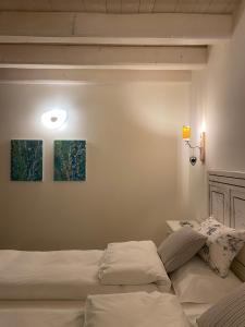 מיטה או מיטות בחדר ב-EDERA dei Guatto