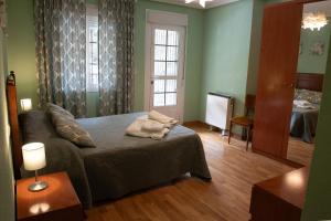 Postel nebo postele na pokoji v ubytování CASA DOVELA
