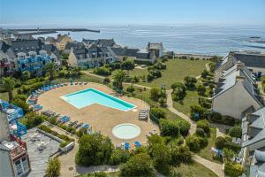 an aerial view of a resort with a swimming pool at Résidence Pierre & Vacances Cap Marine in Le Guilvinec