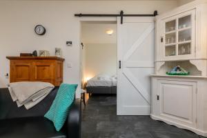 a room with a door leading to a bedroom at Welcome in - Vakantiehuis - Achterweg 10 Zonnemaire ' Sol e Mar' in Zonnemaire