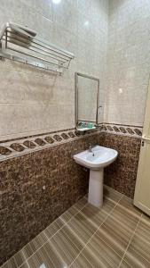 Een badkamer bij روز للشقق الفندقية 3