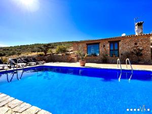 a swimming pool in front of a house at VH CostaBlanca - CALIMA in Benissa