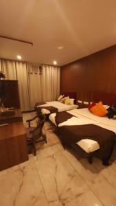 Ένα ή περισσότερα κρεβάτια σε δωμάτιο στο Hotel VRS INNS