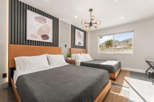 a bedroom with two beds and a window at Desert Oasis in Joshua Tree +31 photos