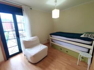 Postel nebo postele na pokoji v ubytování PRAIA DA RAPADOIRA