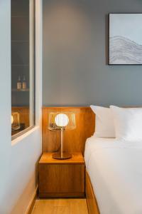 Giường trong phòng chung tại TTR Central Apart Hotel