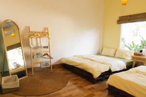 Кровать или кровати в номере Entire First Floor - Nguyên Tầng Trệt- Nhà Mơ Homestay Bến Tre