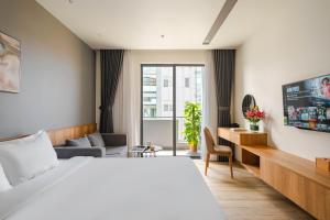 Giường trong phòng chung tại TTR Central Apart Hotel