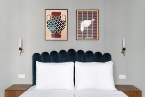 Ein Bett oder Betten in einem Zimmer der Unterkunft Numa Vienna Terra