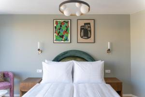Ein Bett oder Betten in einem Zimmer der Unterkunft Numa Vienna Terra