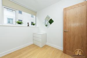 an empty room with a door and a window at Persephone Apartment - The Goddess of Town in Southampton