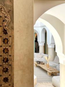 a bedroom with beds in a room with arch ceilings at RIAD ILYM - Riad privatif Marrakech Medina in Marrakesh