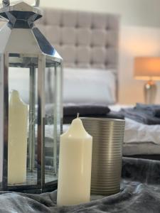 a table with two candles in a hotel room at Roundhay Flat Duplex - Sleeps 2 in Roundhay