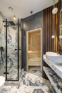 a bathroom with two sinks and a shower at 2-Bedroom DeLux Apartment with Private Sauna WWA25 in Warsaw