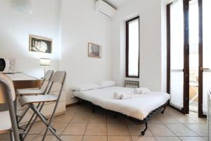 Letto o letti in una camera di PrimoPiano - Scalvini