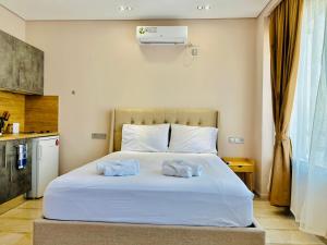 Postel nebo postele na pokoji v ubytování PORT TWINS SUITES No1